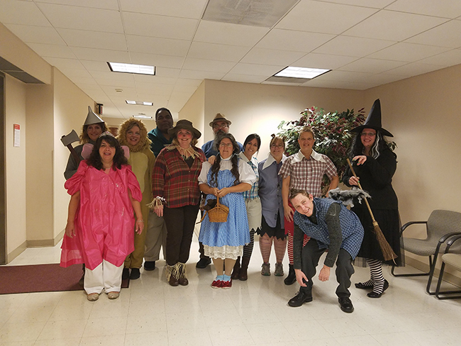 Photo of Treasurers Office dressed as the cast of Wizard of Oz for Halloween.